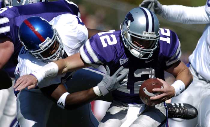 Oct 8, 2005; Manhattan, KS, USA; Kansas State Wildcats quarterback Allan Evridge is tackled by Kansas Jayhawks linebacker #59 Brandon Perkins in the first half at KSU Stadium in Manhattan, KS. Mandatory Credit: Photo by John Rieger-USA TODAY Sports Copyright (c) 2005 John Rieger